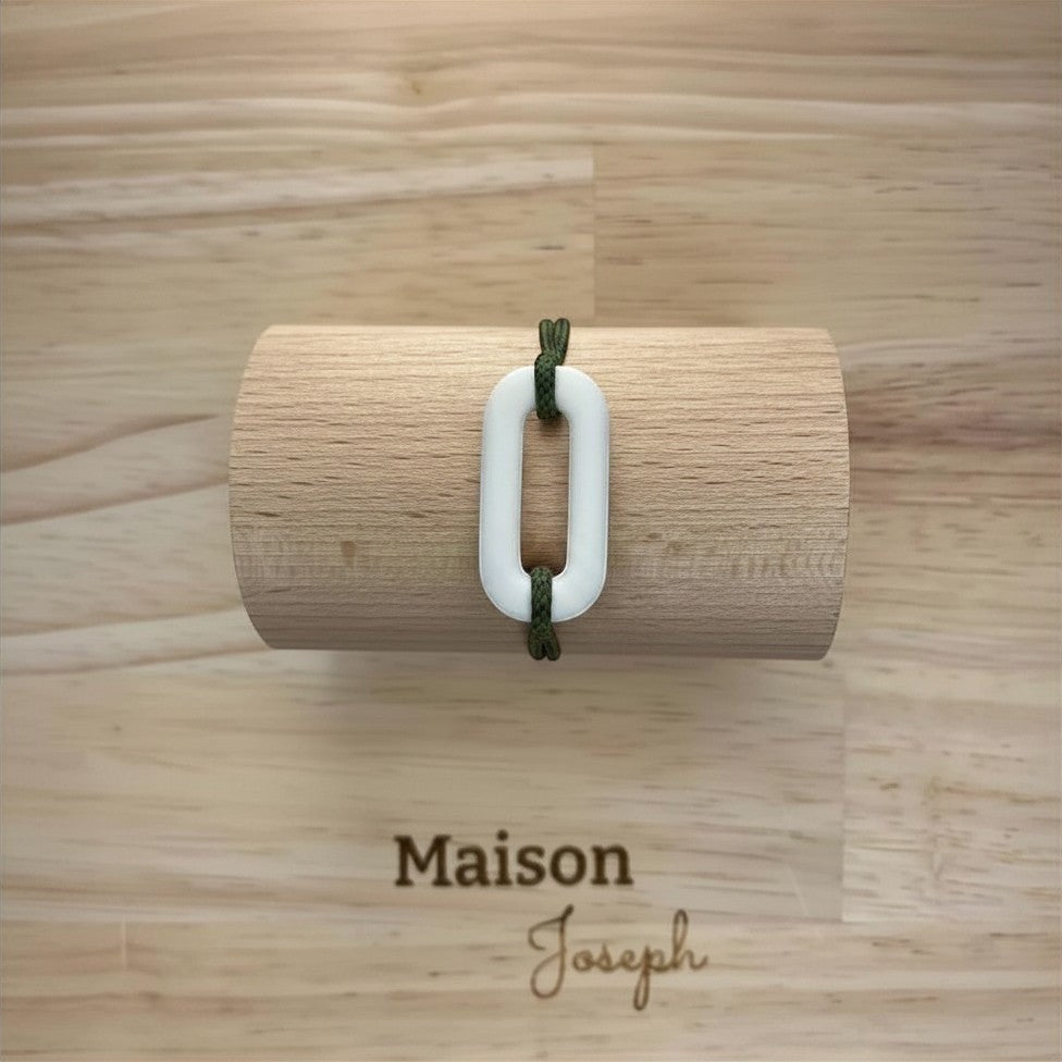 Maison Joseph white ceramic link bracelet on adjustable dark green sport cord